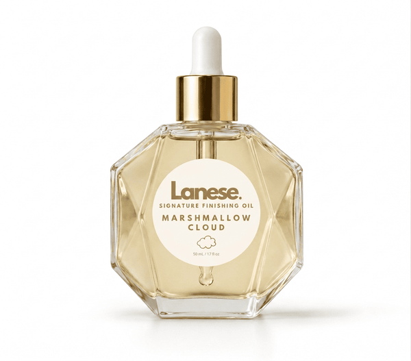 Lanese Signature Finishing Oil in Marshmallow Cloud scent, in a faceted clear glass bottle with a gold collar and white dropper cap, on a white background.
