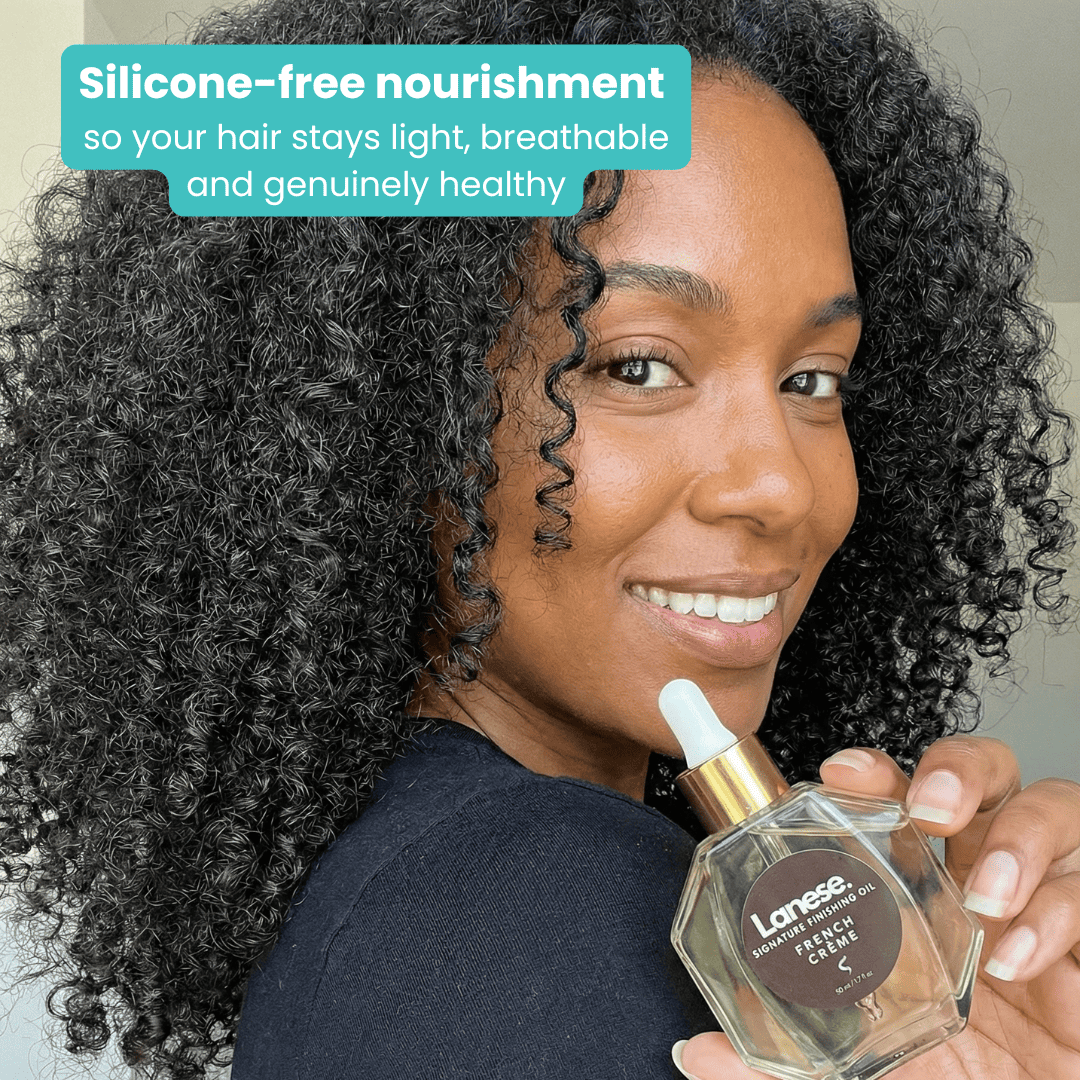 A smiling woman with a voluminous, dark curly afro holds a bottle of Lanese hair oil. Teal text at the top says: "Silicone-free nourishment so your hair stays light, breathable and genuinely healthy."