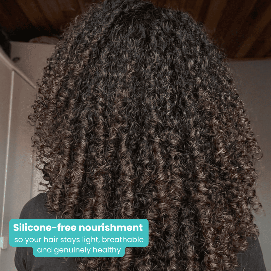 Rear view of a person with very long, dark, highly defined spiral curls. At the bottom, a teal text box reads: "Silicone-free nourishment so your hair stays light, breathable and genuinely healthy."