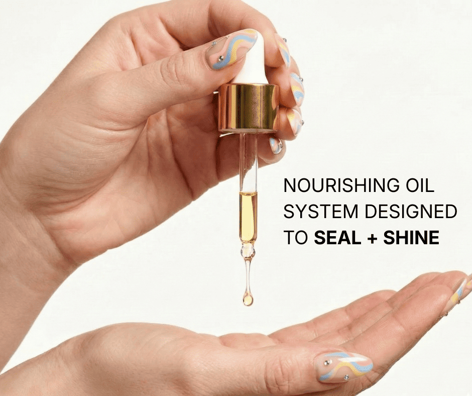 A close-up photo of two hands with colorful swirl-patterned nail art. The top hand holds a gold and white glass dropper, releasing a single golden drop of oil into the open palm of the lower hand. To the right, black text reads: "NOURISHING OIL SYSTEM DESIGNED TO SEAL + SHINE."